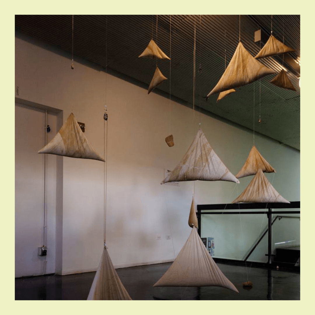 triangle sand bags hang from ceiling at different distances from the floor